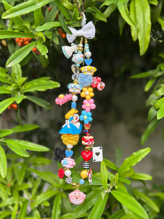 Phonstrap+collana+charm Alice e le sue meraviglie